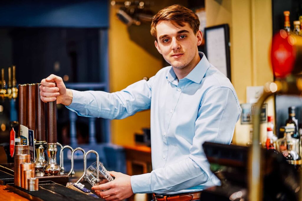 Josh Butler working on the bar at The Maynard, 2021